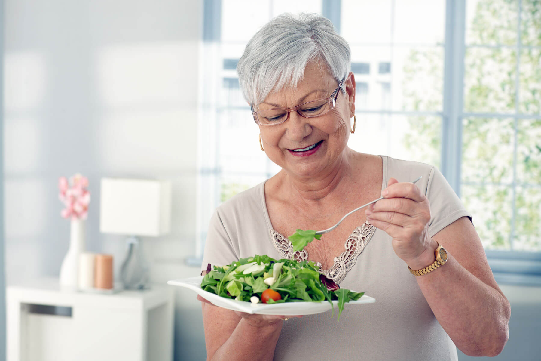 Elderly Woman Eating Salad